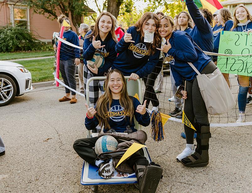 Students pose in the Homecoming Parade.